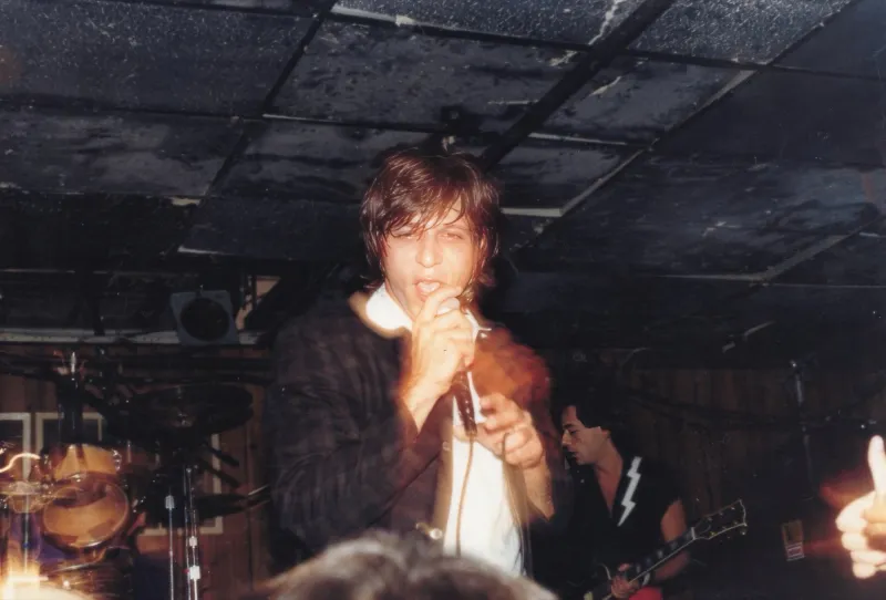 Young Joe Cerisano singing on stage